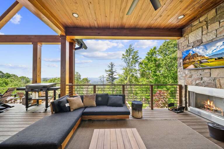 Outdoor Covered Living Space with Wood Burning Fireplace and TV