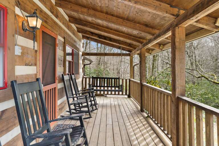 Covered Front Porch in a Peaceful Wooded Setting