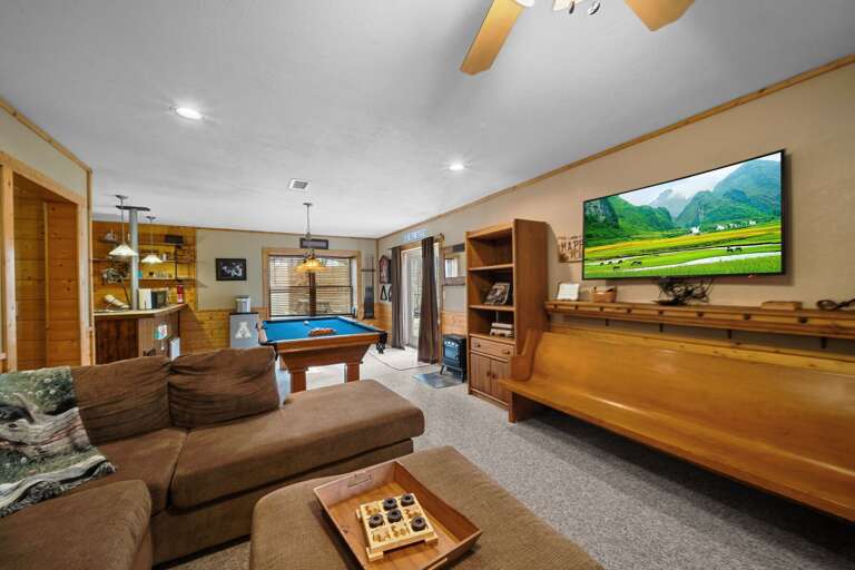 Family Room with TV, Cozy Sofa, Bar Area and Game Tables