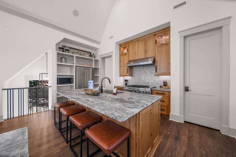 Additional Seating at the Kitchen Island Provides the Option to Dine Together with a Full House