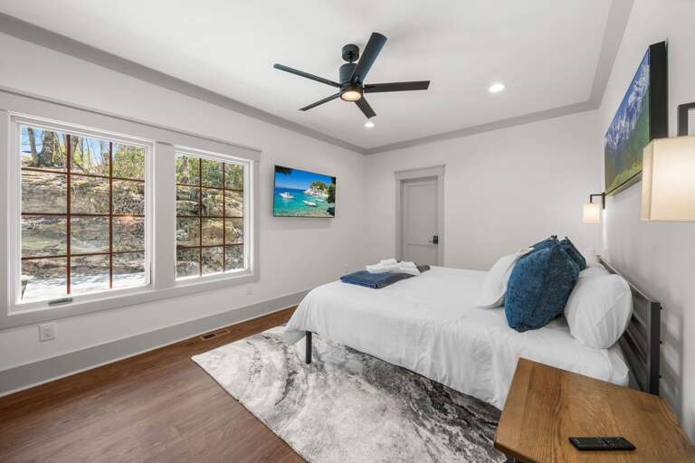 TV and Windows Revealing Lovely Natural Stone Wall