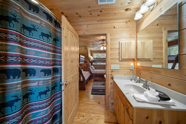 Upstairs Bunk Room Bathroom with Tub and Shower Combo