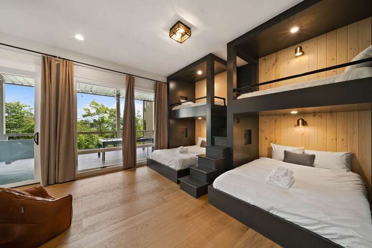 Bunk Room has Two Queen Beds with Two Suspended Twin Beds Above