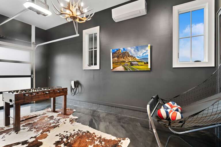 Lower Level Garage Game Room with Multiple Games and TV