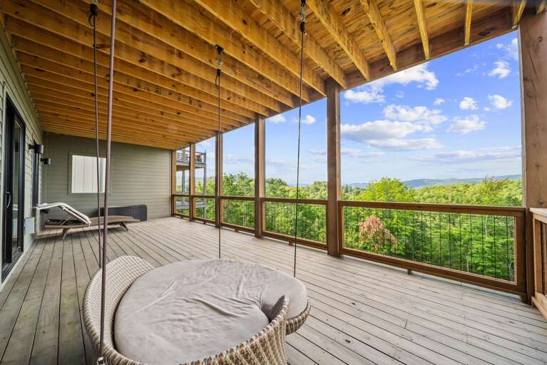 Lower Level Deck with Lounge Chairs and Swinging Chair Lower Level Deck with Lounge Chairs and Swinging Chair