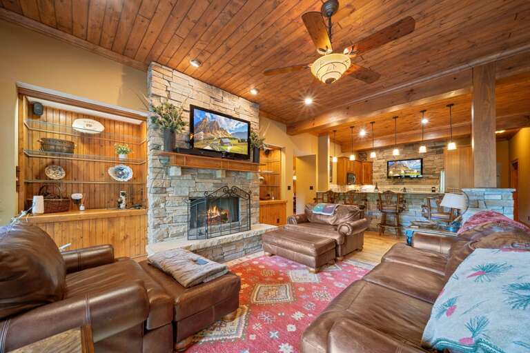 Lower Level Den with Stacked Stone Fireplace, and TV Lower Level Den with Stacked Stone Fireplace, and TV