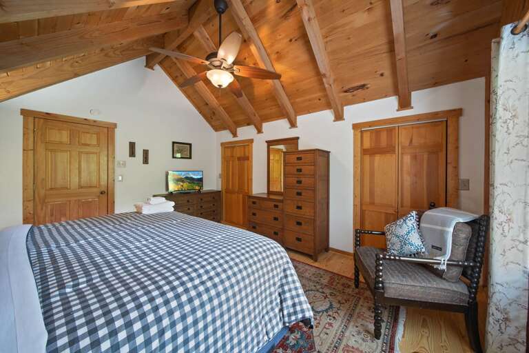 TV and Accent Chair in the King Bedroom