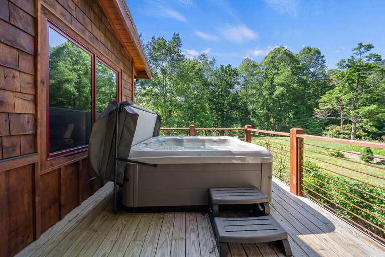 Hot Tub on the Deck Surrounded by the Peaceful Setting Hot Tub on the Deck Surrounded by the Peaceful Setting