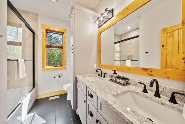 Tub and Shower Combo with Dual Sink Vanity in the Queen Ensuite Tub and Shower Combo with Dual Sink Vanity in the Queen Ensuite