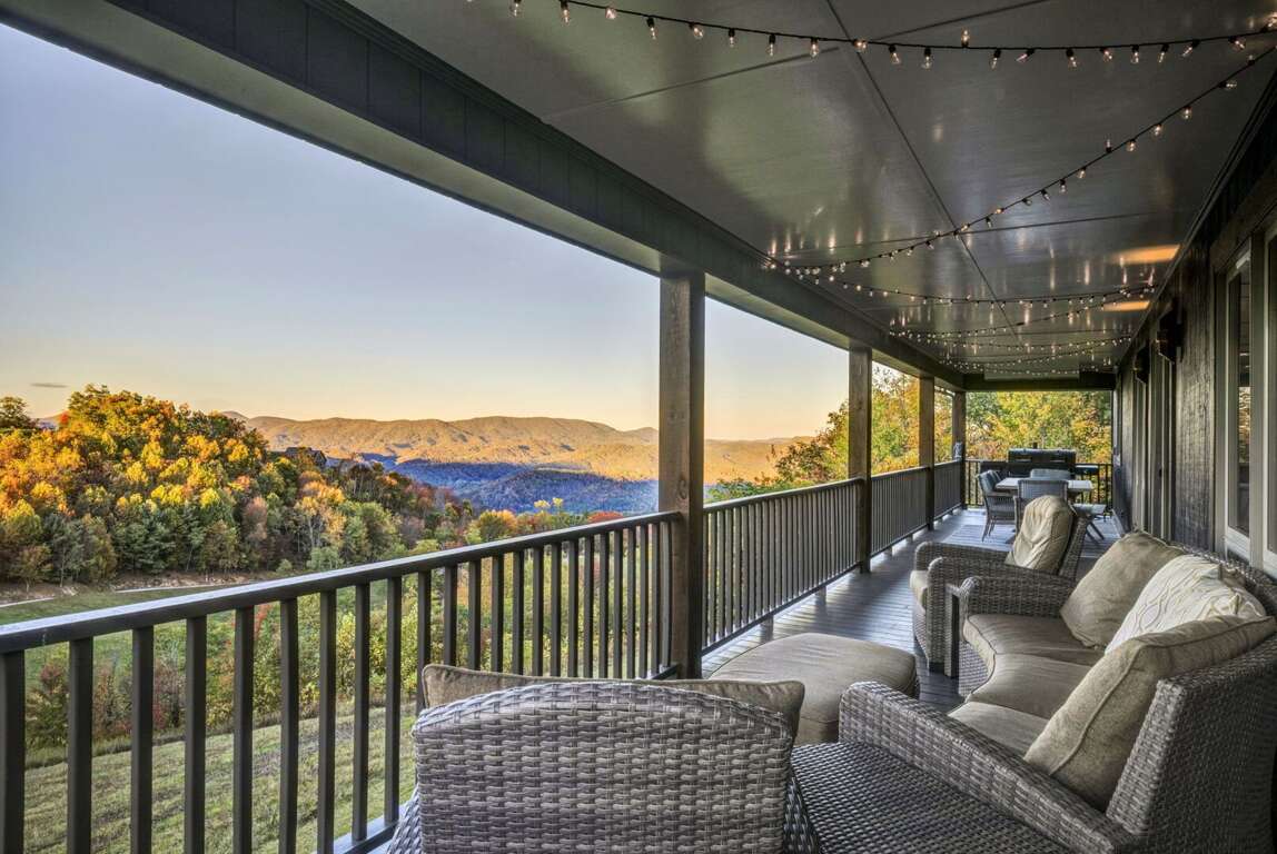 Covered Upper Level Deck with Outdoor Seating and Dining Area Covered Upper Level Deck with Outdoor Seating and Dining Area