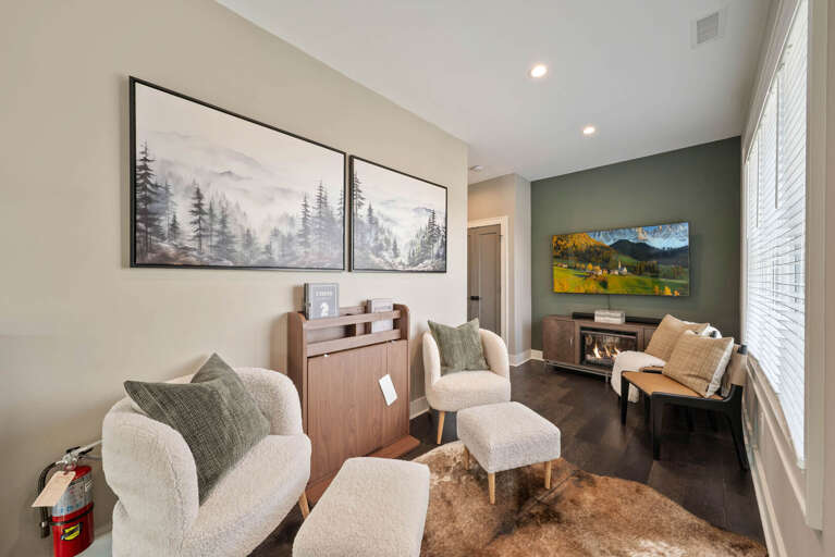 Upper Level Sitting Area with TV, Chess Set and Electric Fireplace for Ambiance