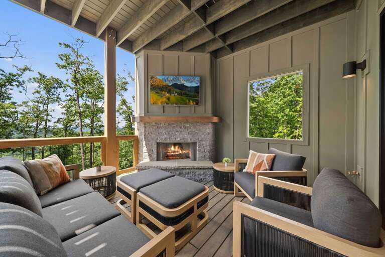 Wood Burning Fireplace and TV with Comfortable Seating on the Deck