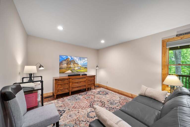 Lower Level Family Room with TV and Leather Pull Out Sofa, Converts to a Queen Sleeper