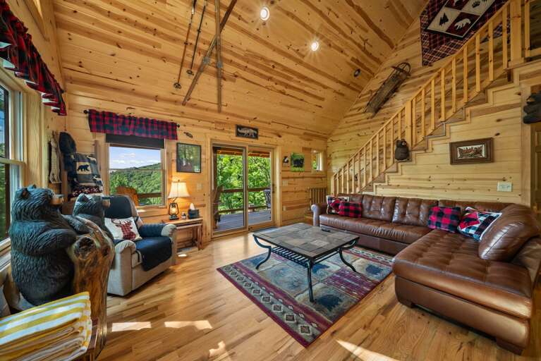 Living Room has Vaulted Ceilings, Wood Floors and Comfortable Seating
