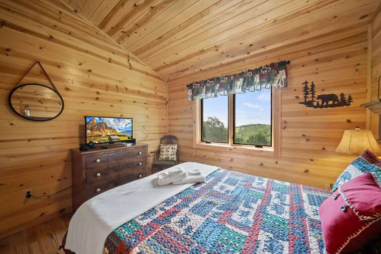 Queen Bed and TV in the Upper Level