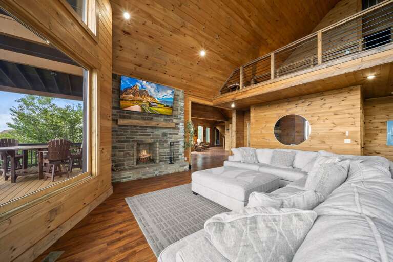 Large Sectional, Wood Burning Fire Place and TV in the Main Level