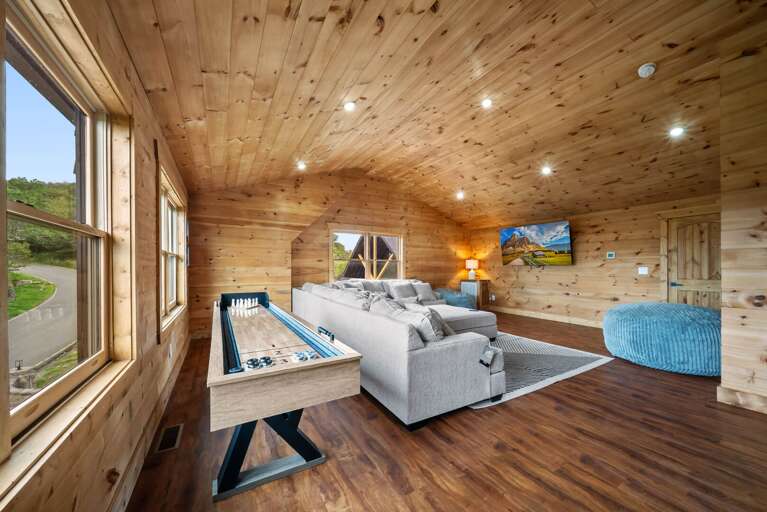 Upper Level Family Room with Shuffleboard and Large Sectional Sofa