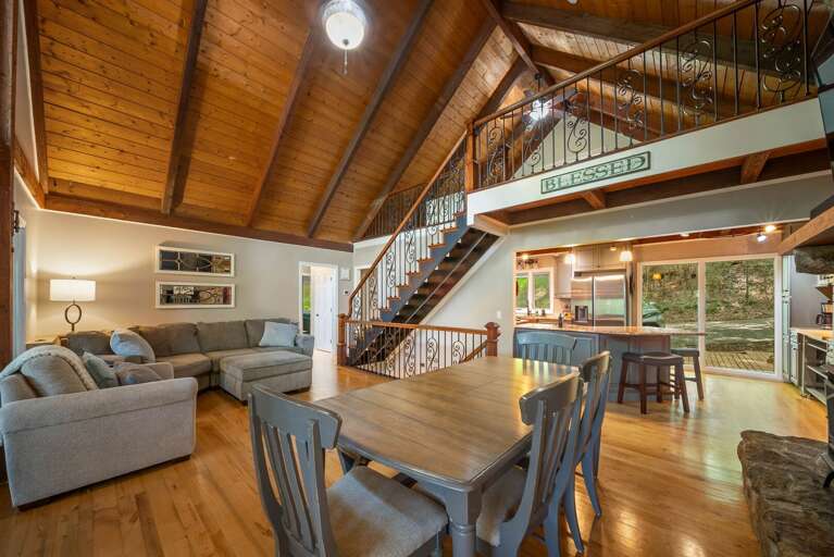 Main Floor Living Area with Sectional Sofa, Dining and Kitchen