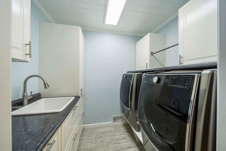 Spacious Laundry Room with High End Washer and Dryer