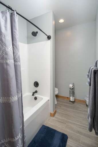 Lower Level Bathroom with Tub and Shower Combo