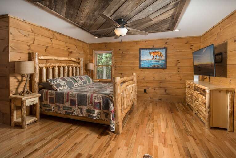 Main Floor Master Bedroom with King Bed and TV