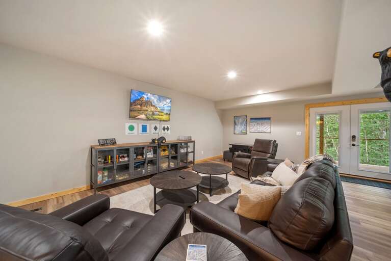 Lower Level Family Room with Theater Style TV Set Up,  a Plethora of Games, and an Arcade Machine Lower Level Family Room with Theater Style TV Set Up,  a Plethora of Games, and an Arcade Machine