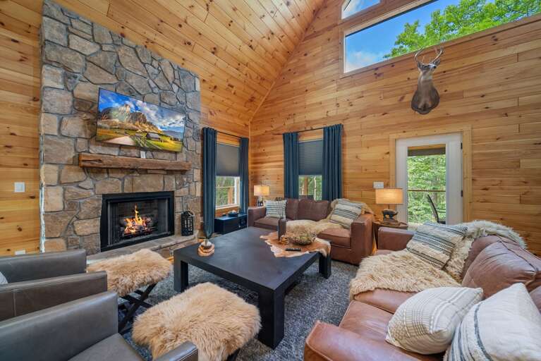 Plenty of Leather Seating in the Living Room with Plush Touches Plenty of Leather Seating in the Living Room with Plush Touches