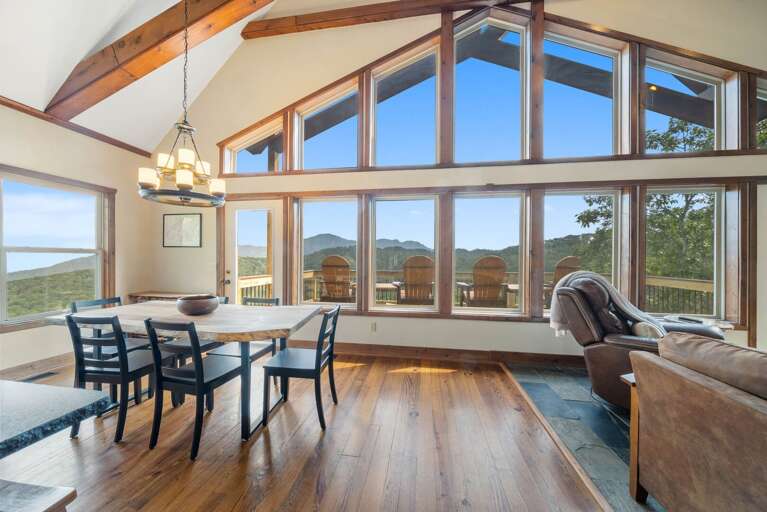 Dining Area with a Wall of Windows Toward Incredible Views