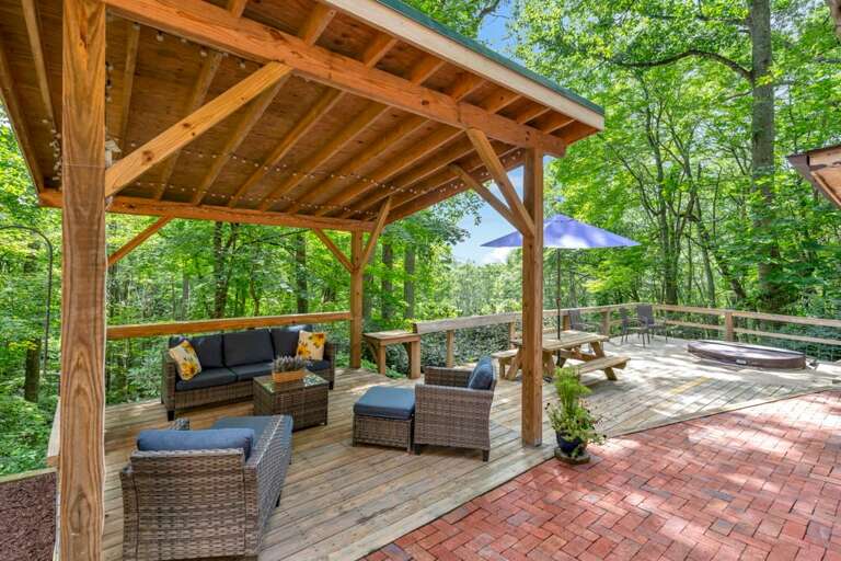 Patio Has Covered Seating, Picnic Table and In-Ground Hot Tub