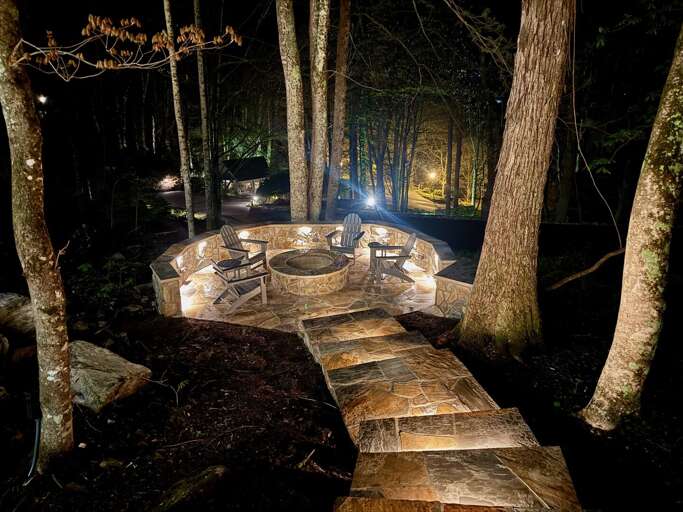 Custom Built Flagstone Fire Pit with Lit Walkway and Adirondack Seating Custom Built Flagstone Fire Pit with Lit Walkway and Adirondack Seating
