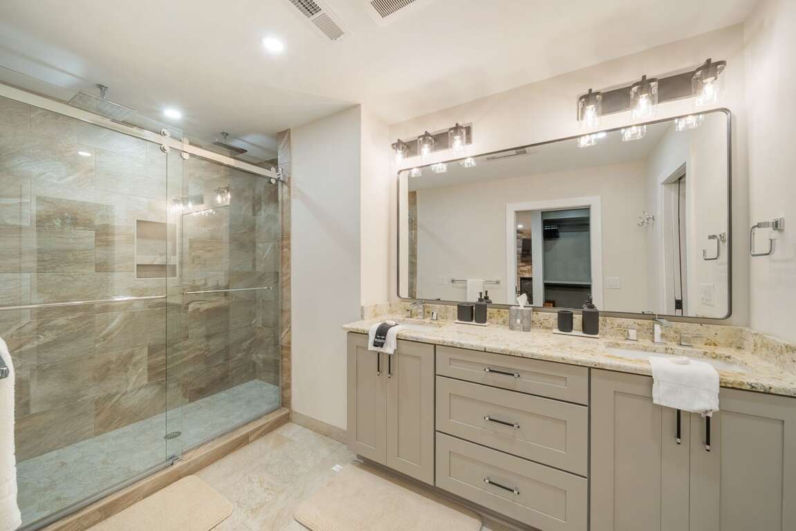 Ensuite Bathroom with Tiled Shower and Dual Sink Vanity Ensuite Bathroom with Tiled Shower and Dual Sink Vanity