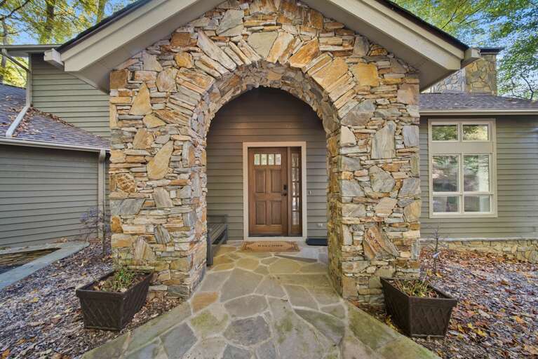 Front Entrance with Flagstone Path and Stone Archway Front Entrance with Flagstone Path and Stone Archway