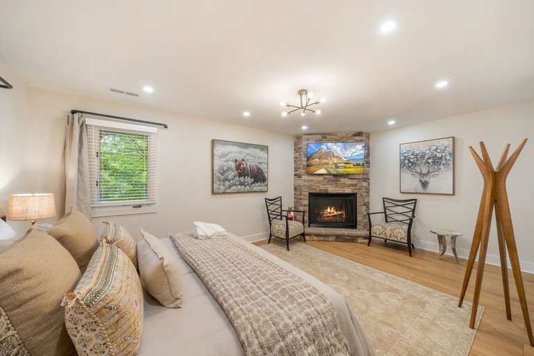 King Bed, Gas Fireplace, and TV in the Master Bedroom King Bed, Gas Fireplace, and TV in the Master Bedroom