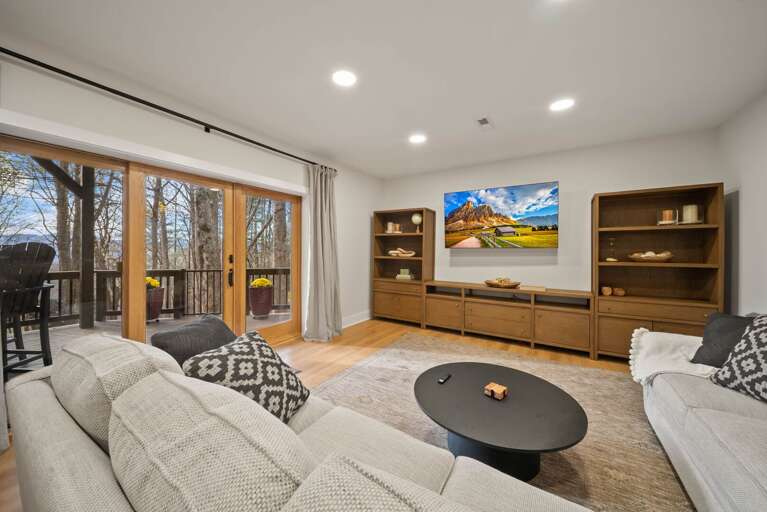 Lower Level Den with Wall of Windows to the Lower Level Deck