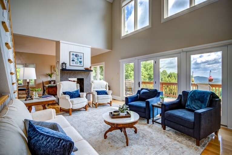 Living Room with Big Windows Leads to the Large Main Level Deck