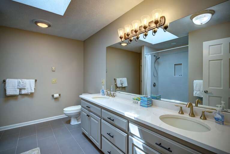 Upper Level Jack-and-Jill Bathroom with Double Vanity and Step-In Shower