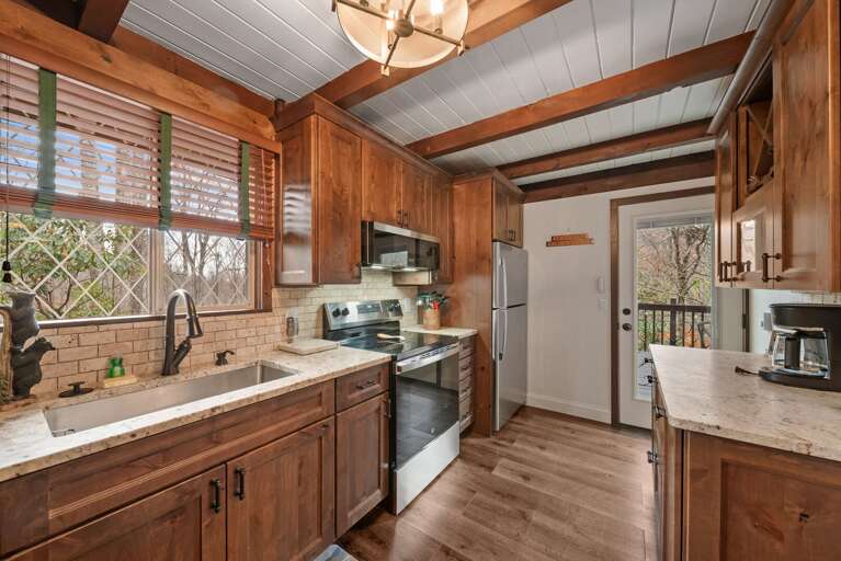Quaint Kitchen with Basin Sink and Stainless Appliances