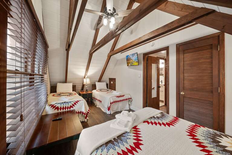 Upper Level Bedroom with a Queen and Two Twins