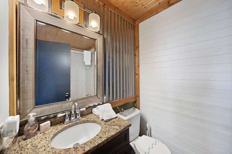 Lower Level Full Bathroom with Tiled Tub and Shower Combo