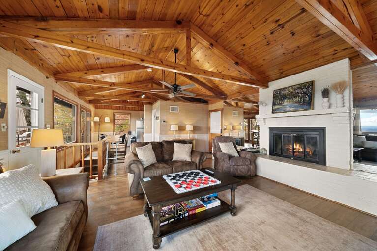 Vaulted Wood and Exposed Beams, Wood Burning Fireplace and Plenty of Seating