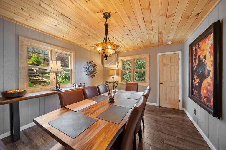 Dining Room with Wood Table, Natural Light and Great Artwork