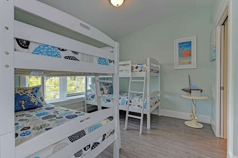 Den area with 1 twin bunk beds and the second bunk is now a single twin bed