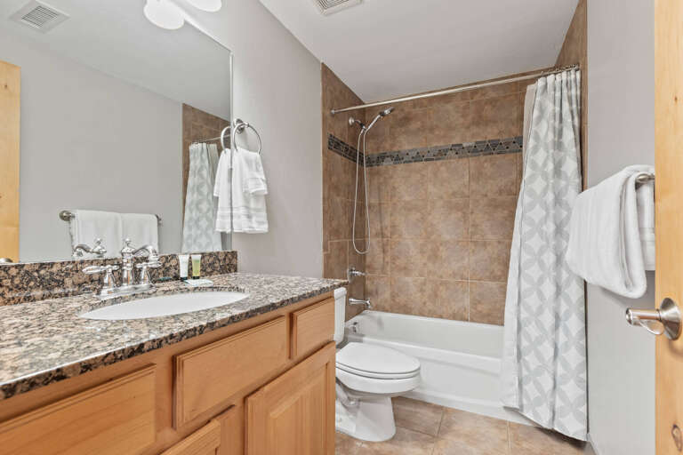 Bear Hollow Lodges 3307: A bathroom, shared with the second and third bedrooms has a large single sink, plenty of counter top space and a tub/shower combination.