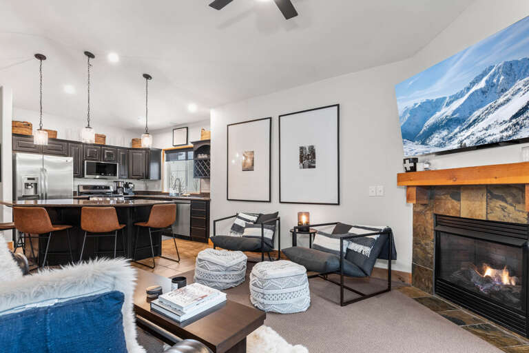 Bear Hollow Lodges 3401: An inviting living room arrangement with a gas fireplace and easy access to the outdoor balcony.