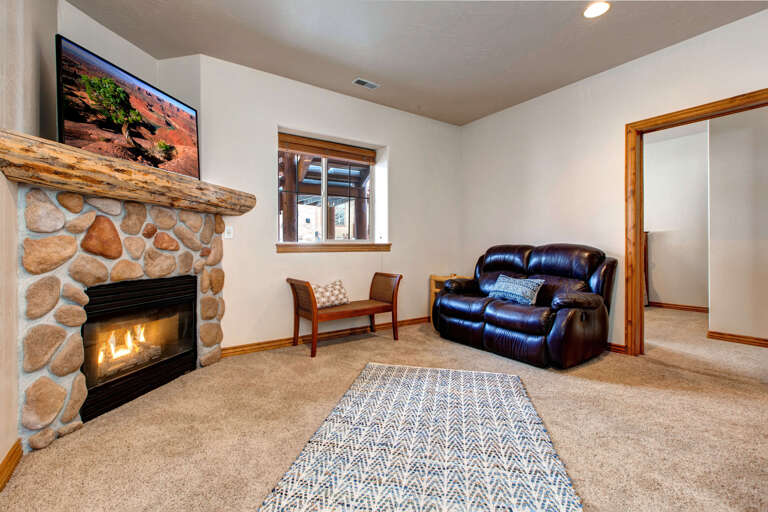 Bear Hollow 5478: Cozy sofa by the fireplace, perfect for relaxing evenings.