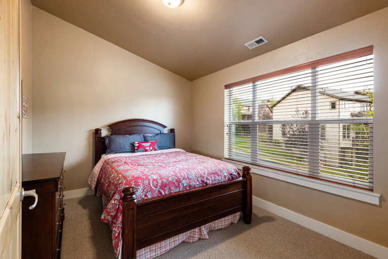 Bear Hollow 5557: Cozy bed by the windows, perfect for a relaxing afternoon read. Bear Hollow 5557: Cozy bed by the windows, perfect for a relaxing afternoon read.