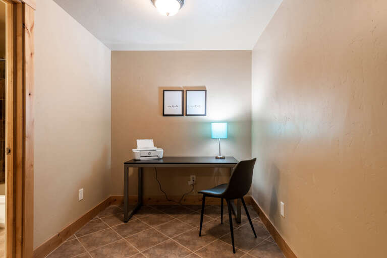 Bear Hollow 5557: Cozy workspace with desk, table, printer, and stylish lamp shade. Bear Hollow 5557: Cozy workspace with desk, table, printer, and stylish lamp shade.