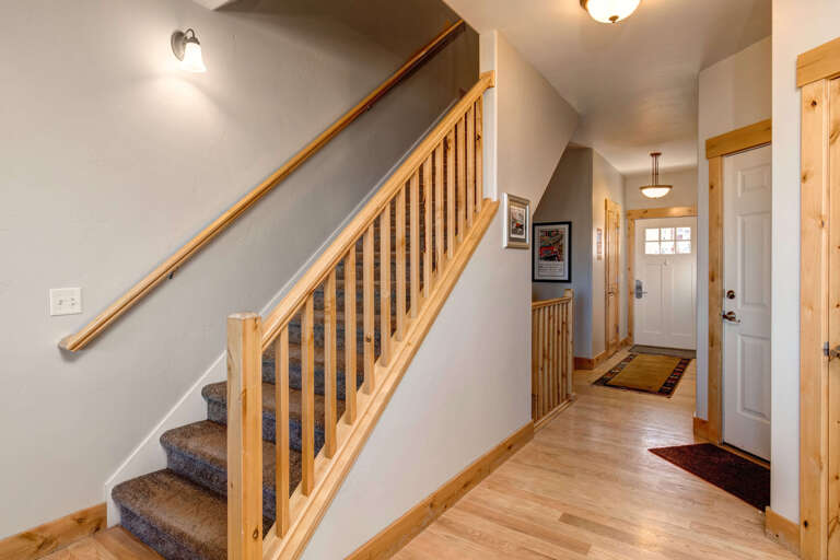 Step into your mountain retreat through this welcoming entryway with warm wood tones and vaulted ceilings that greet you the moment you arrive.