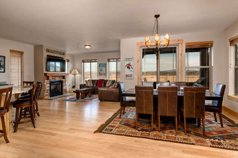 Bear Hollow Village 5639: Cozy space with dining table, sofa, and fireplace for relaxation. Bear Hollow Village 5639: Cozy space with dining table, sofa, and fireplace for relaxation.