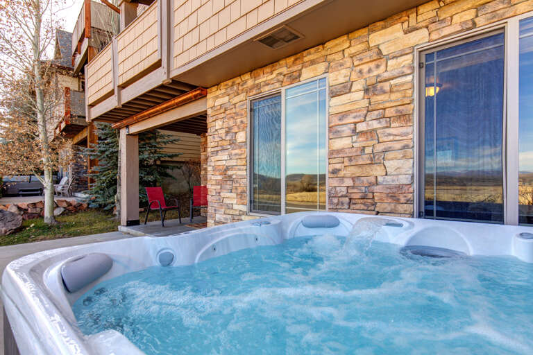 Private Outdoor Hot Tub: "Relaxing soak under the stars, a perfect way to unwind."